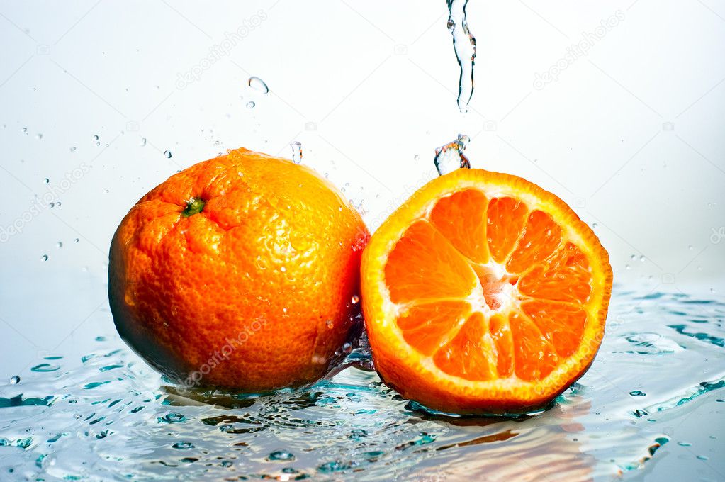 Mandarine in the sparks of water