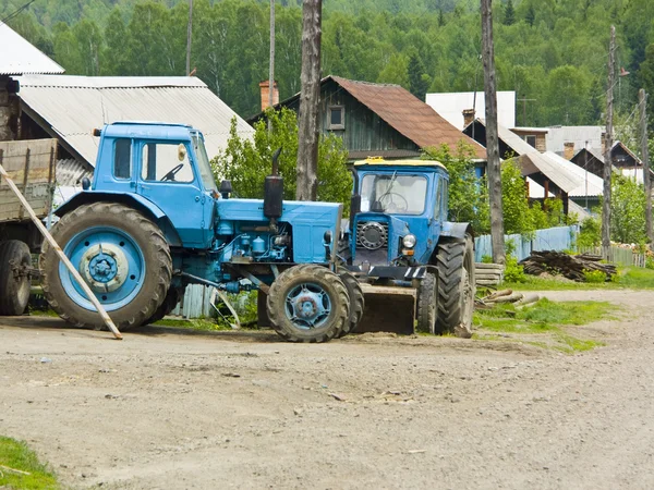 stock image Two tractors costing in rural street