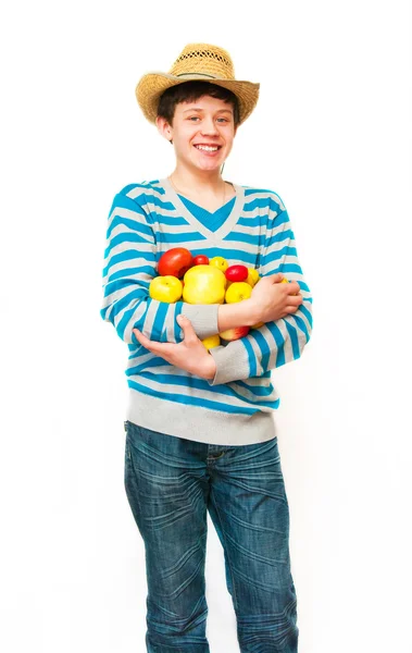 Il giovane in un cappello di paglia con frutto — Foto Stock