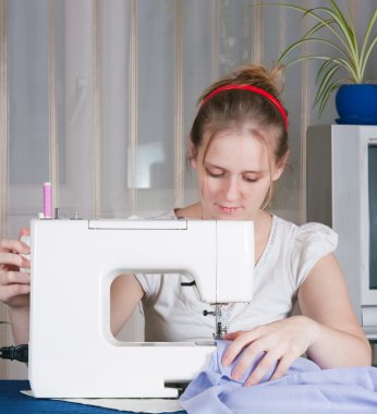 Beautiful girl sewing clipart