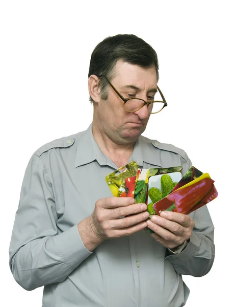 stock image Man holds seeds in firm packing