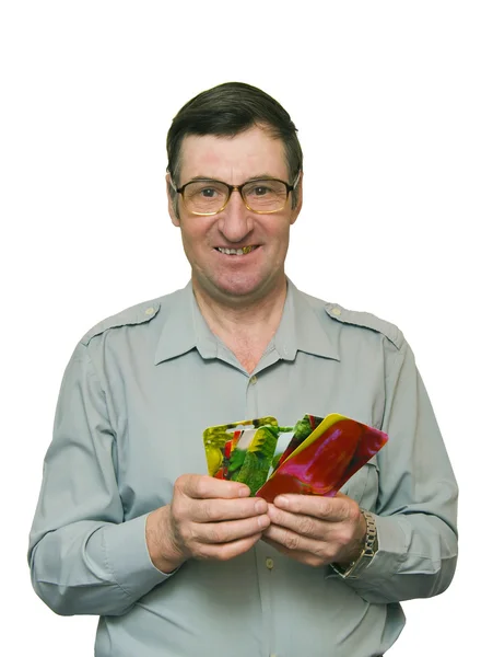 stock image Man holds seeds in firm packing