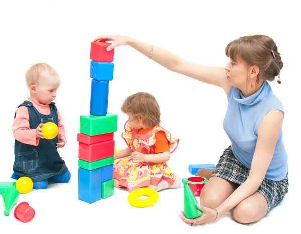 The woman plays with two girls — Stock Photo, Image