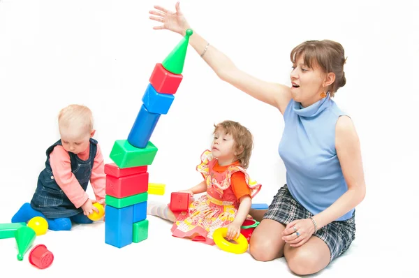 The woman plays with two girls — Stock Photo, Image