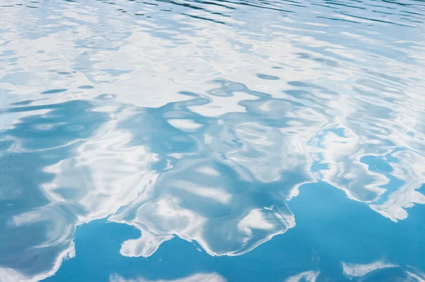 stock image Clouds reflected in water