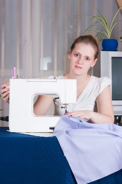 stock image Beautiful girl sewing