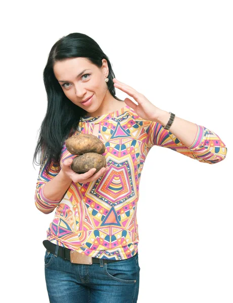 The girl with a crude potato in hands! — Stock Photo, Image