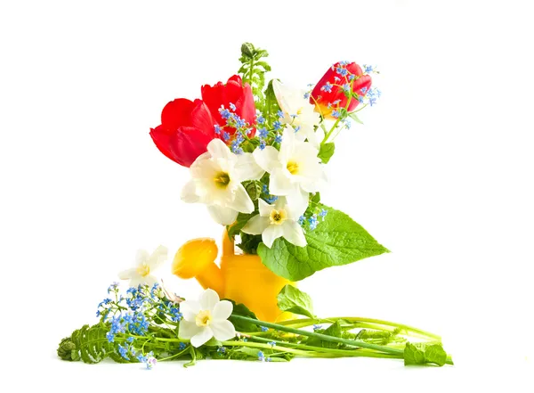 Bouquet of spring flowers in a children's wateri — Stock Photo, Image