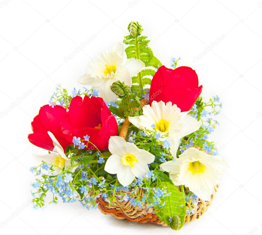 Bouquet of spring flowers in a wattled basket