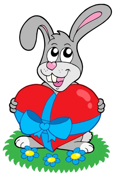 Щасливий кролик з серцем — стоковий вектор