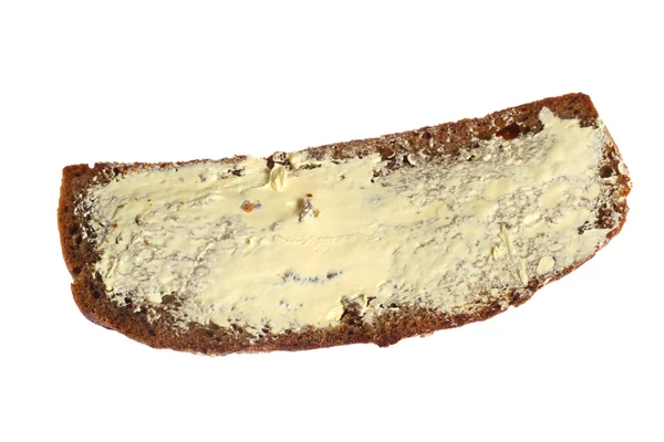 Pão escuro com manteiga — Fotografia de Stock