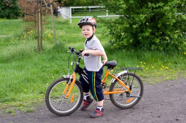 Boy on bicycle clipart