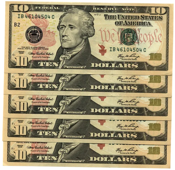 Heap of ten dollars isolated on white — Stock Photo, Image
