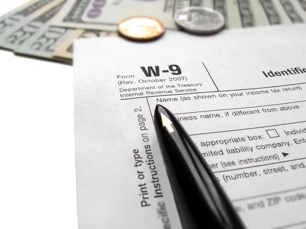 Filling the w9 Tax form by pen — Stock Photo, Image