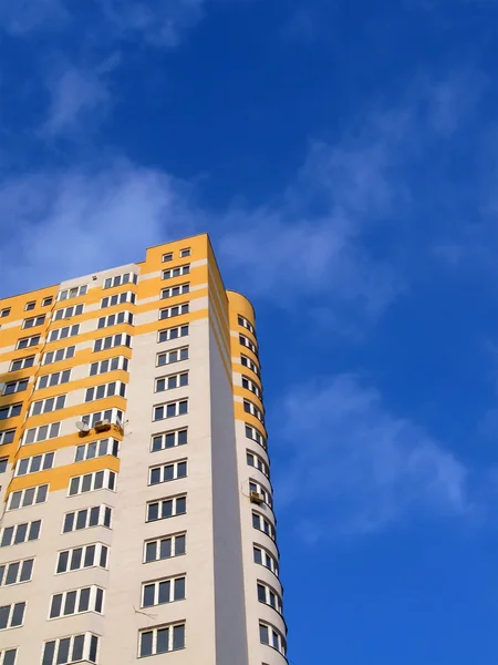 New colorful yellow building, blue sky — Stock Photo, Image