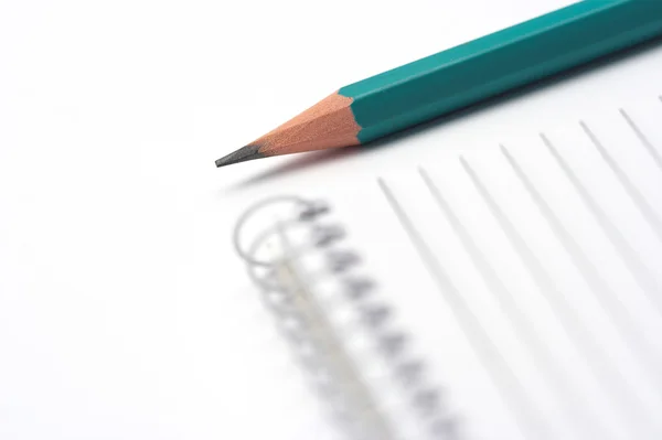 Ручка и ноутбук — стоковое фото