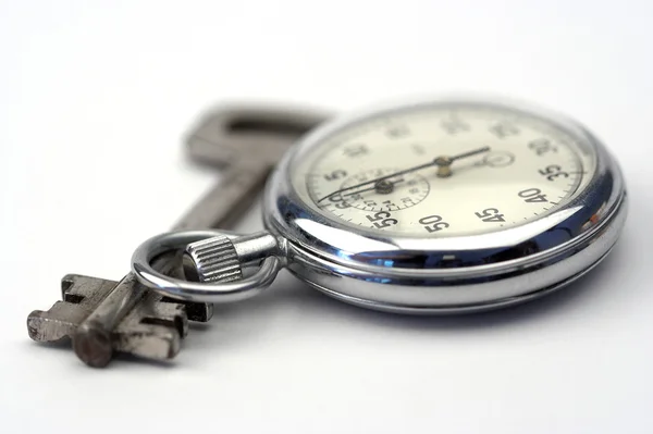 Relógio e chave — Fotografia de Stock
