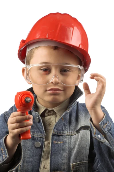 Niño en un casco rojo — Foto de Stock