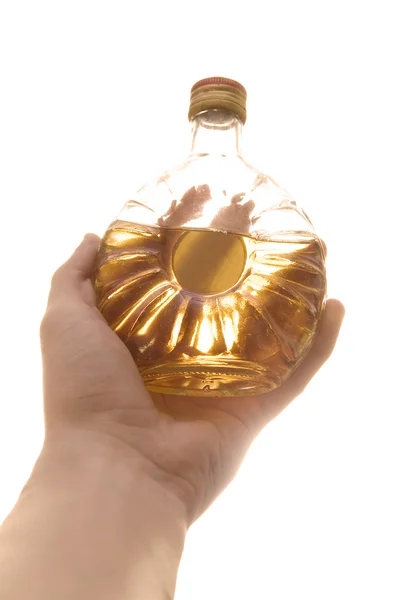 Whiskeyflasche in der Hand. — Stockfoto