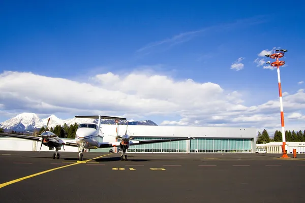 Small airplane on runway Stock Picture