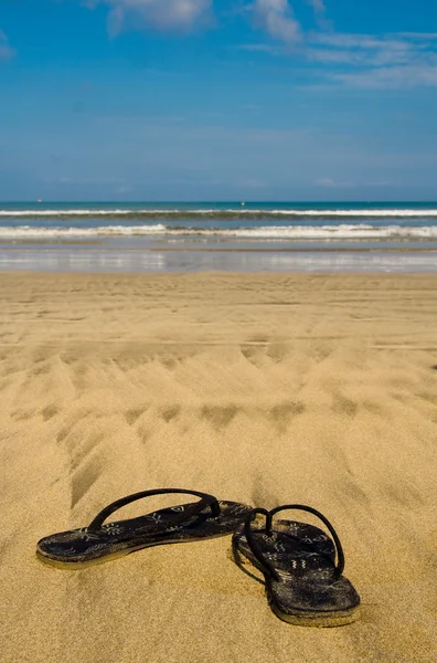 Sandals on beach — Stock Photo, Image