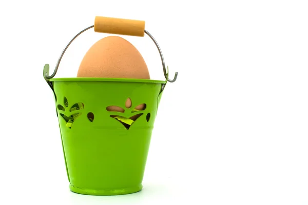 Egg in green basket — Stock Photo, Image