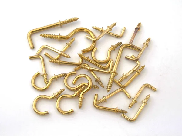Assorted brass hookes. — Stock Photo, Image