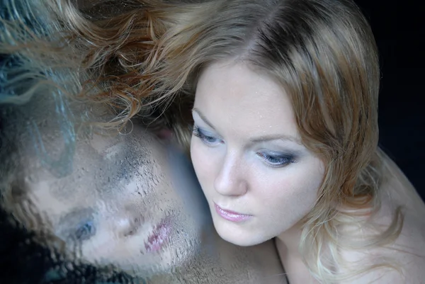 Close-up portrait blonde with a mirror — Stock Photo, Image