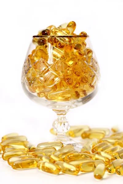 Glas met gouden bolussen — Stockfoto