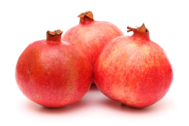 Three fresh appetizing pomegranates clipart