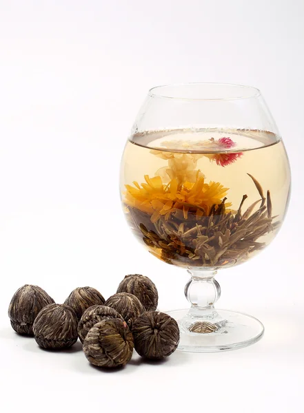 stock image Glass with a flower green tea