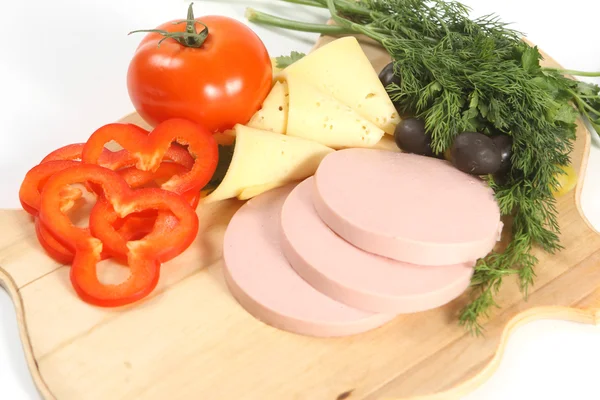 Sliced food arrangement with sausage — Stock Photo, Image