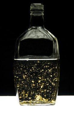 Liqueur with golden flakes clipart