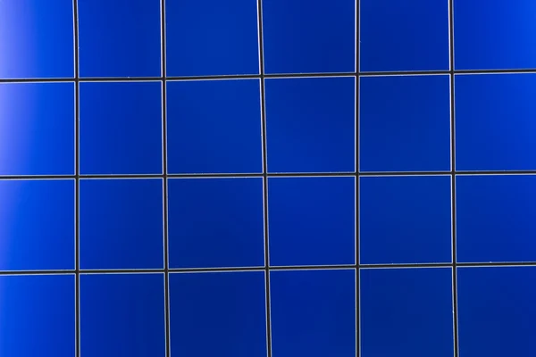 Metal mesh on the blue background — Stock Photo, Image