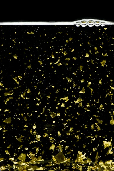Licor con copos de oro — Foto de Stock