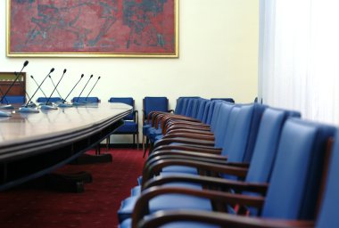 Microphones in the empty conference hall clipart