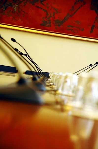 Microphones in empty conference room — Stock Photo, Image