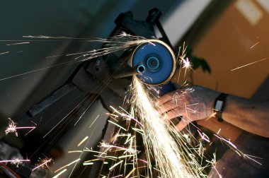 Angle grinder in use clipart