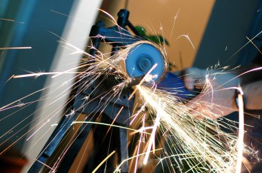 Angle grinder in use clipart
