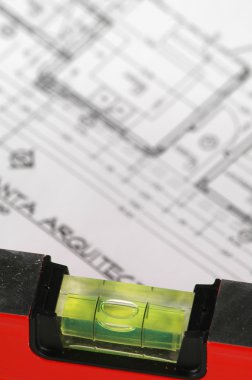 Spirit level and architectural plans clipart