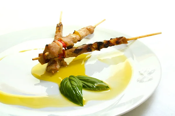 stock image Meat skewer with olive oil garnish