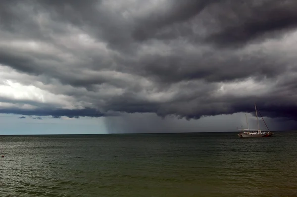 stock image Single boat in storm