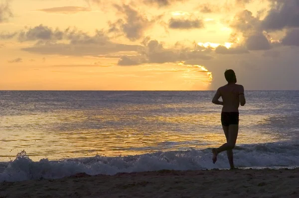 Stock image running on the beach