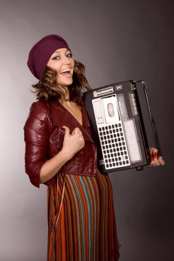 The happy girl with the tape recorder clipart