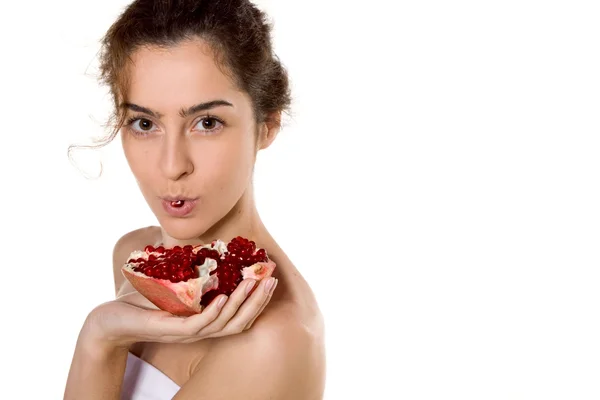 Beautiful brunette girl with pomegranate — Stock Photo, Image