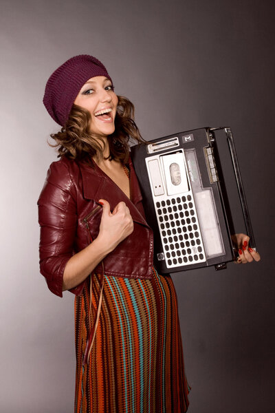 The happy girl with the tape recorder