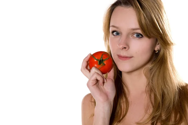 年轻漂亮的女人和番茄 免版税图库图片