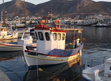 Fishing boat in greek harbour clipart
