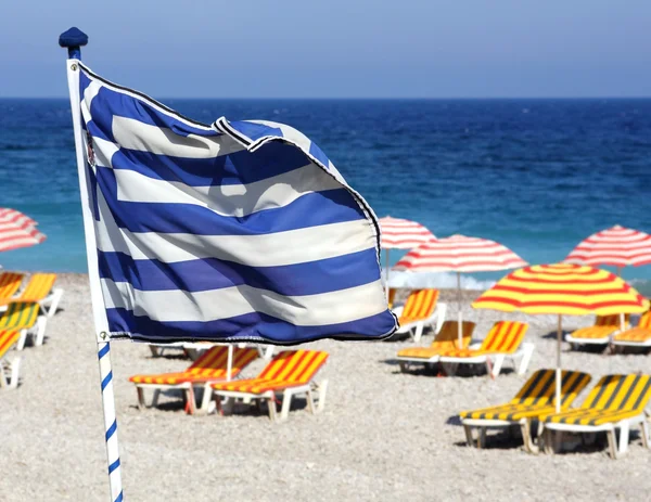 Greek flag on the beach — Stock Photo, Image