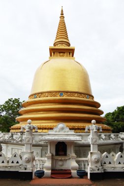 Golden stupa in Badulla, Sri Lanka clipart